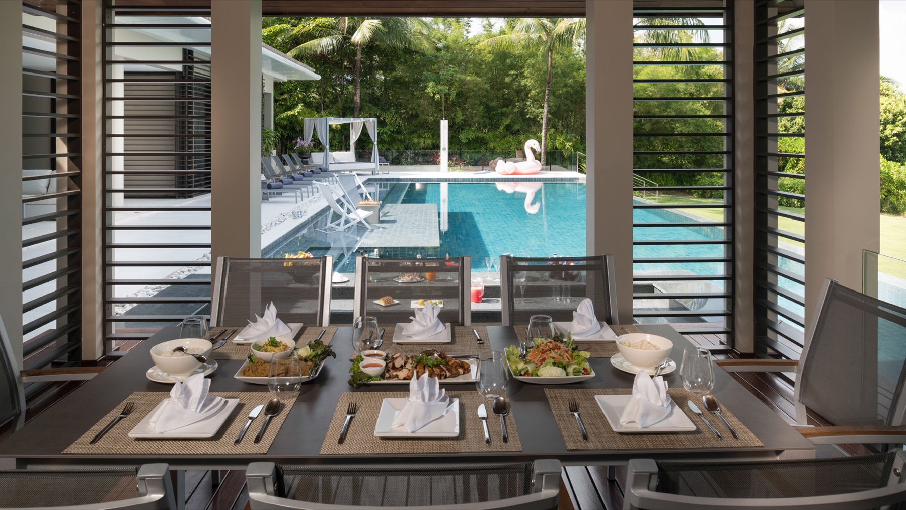 Poolside dining in the open sala