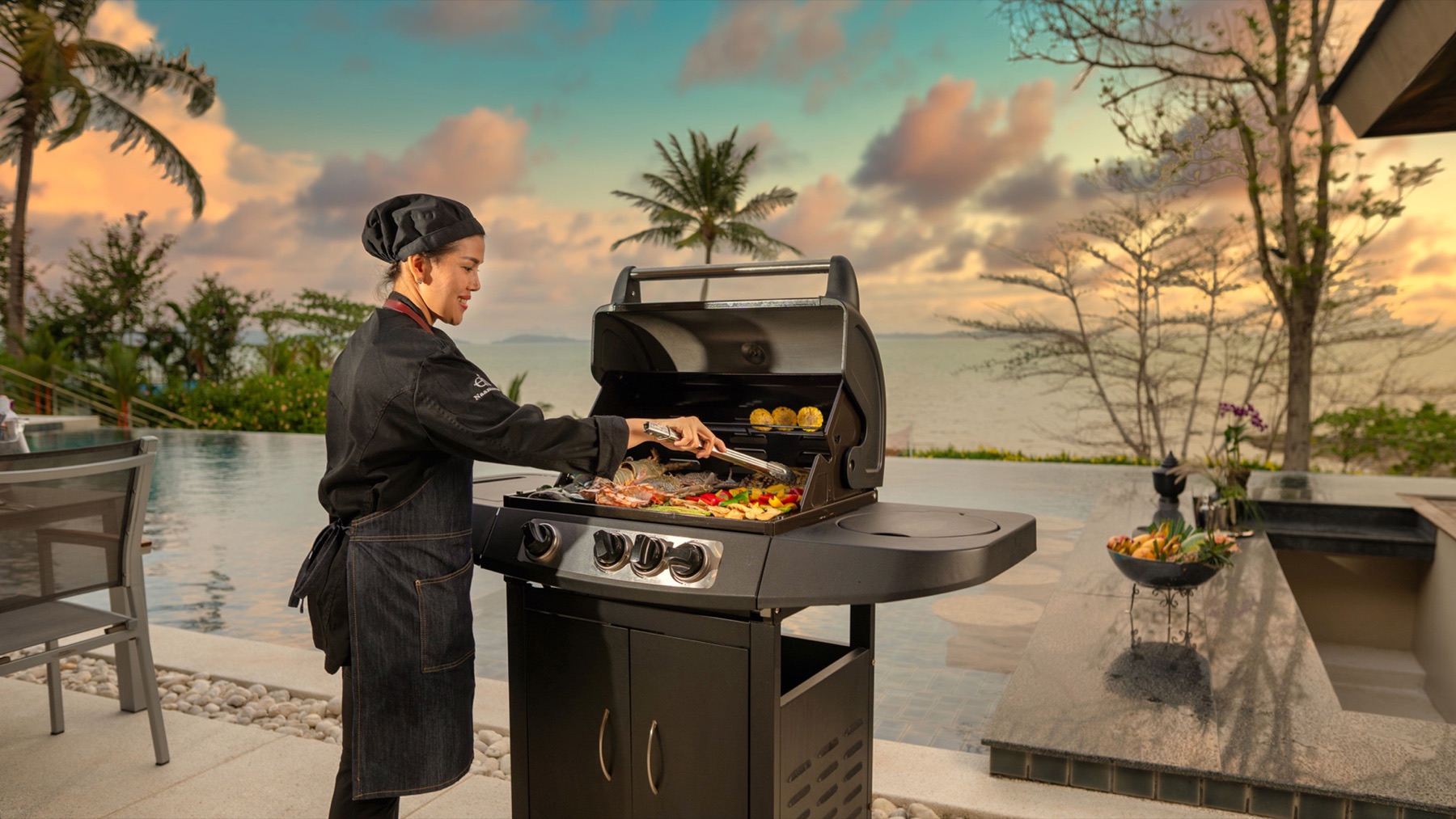 Private chef preparing a poolside meal